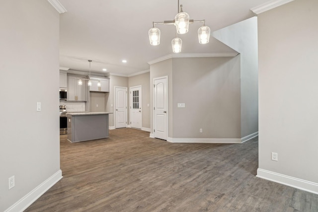 kitchen with pendant lighting, decorative backsplash, stainless steel electric stove, and crown molding