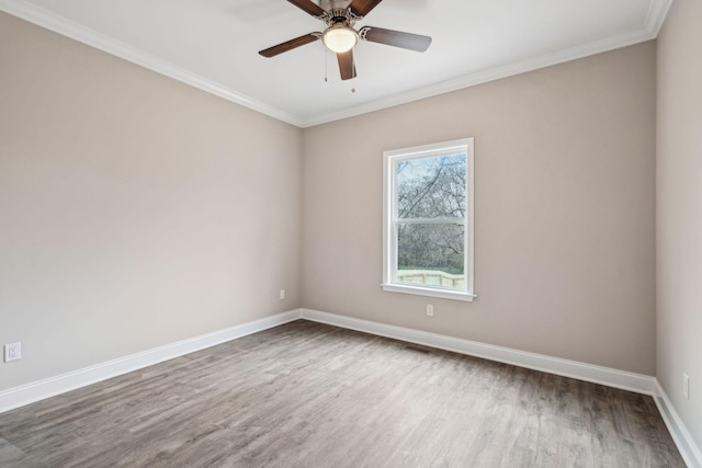 unfurnished room featuring ceiling fan, ornamental molding, and hardwood / wood-style floors