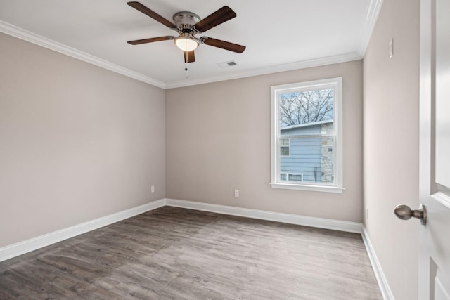 empty room featuring wood-type flooring, ornamental molding, and ceiling fan