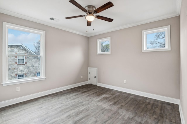 empty room with crown molding, ceiling fan, and dark hardwood / wood-style flooring