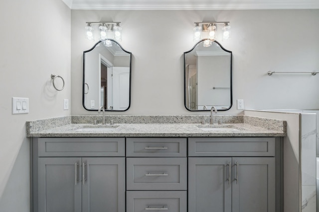 bathroom with vanity and ornamental molding