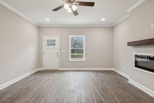 unfurnished living room featuring ornamental molding, dark wood-type flooring, and ceiling fan