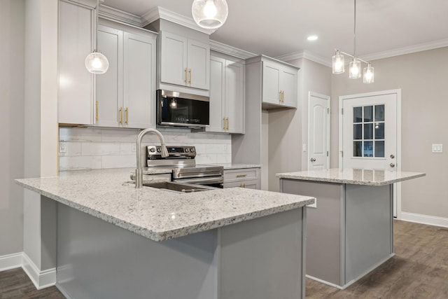 kitchen featuring appliances with stainless steel finishes, light stone countertops, kitchen peninsula, and hanging light fixtures