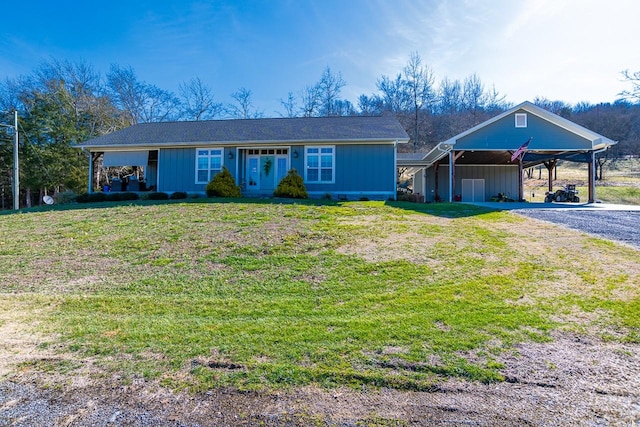 single story home with a front yard and a carport