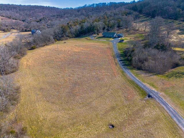 birds eye view of property with a rural view