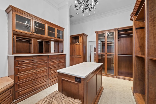 spacious closet featuring a chandelier