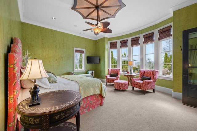 carpeted bedroom with crown molding and ceiling fan