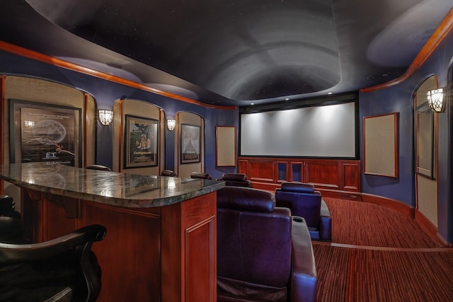 cinema room featuring bar and vaulted ceiling