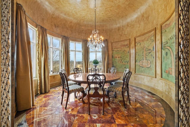 dining area featuring a chandelier