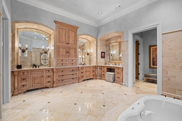 bathroom with ornamental molding, a washtub, vanity, and an inviting chandelier