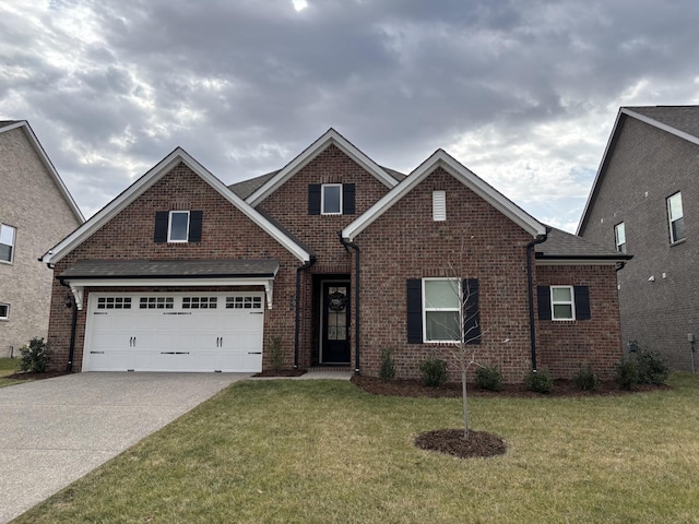 view of front of home with a garage and a front yard