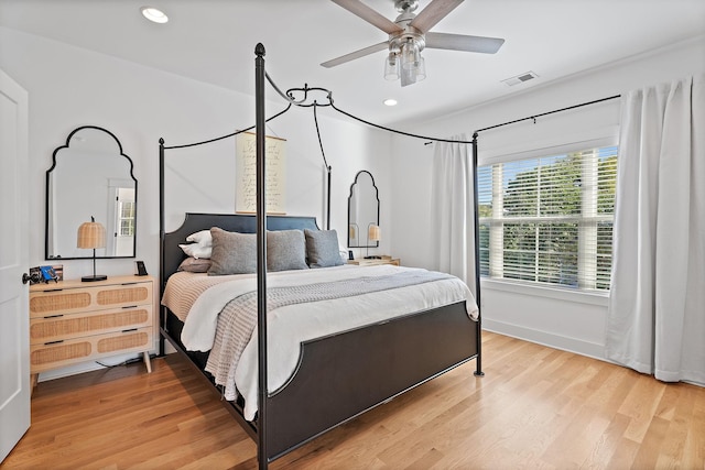 bedroom featuring hardwood / wood-style flooring and ceiling fan