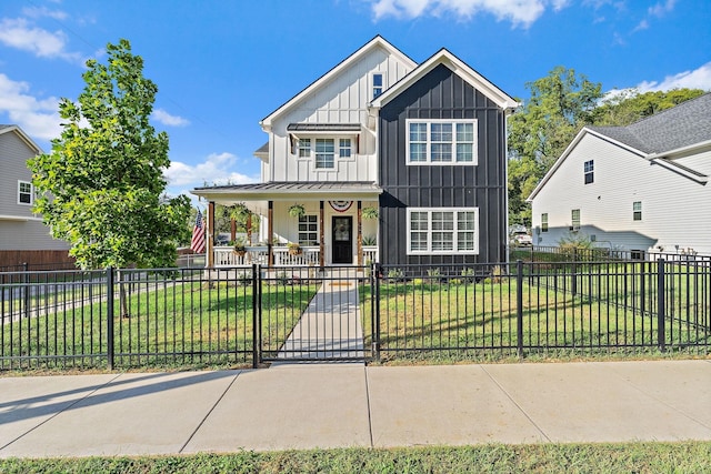 view of front of property featuring covered porch and a front lawn