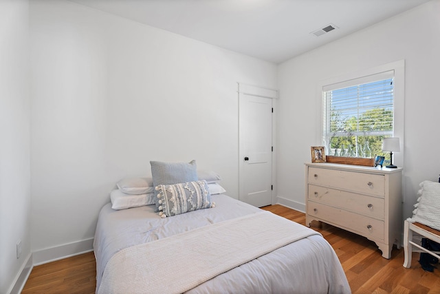 bedroom featuring hardwood / wood-style flooring