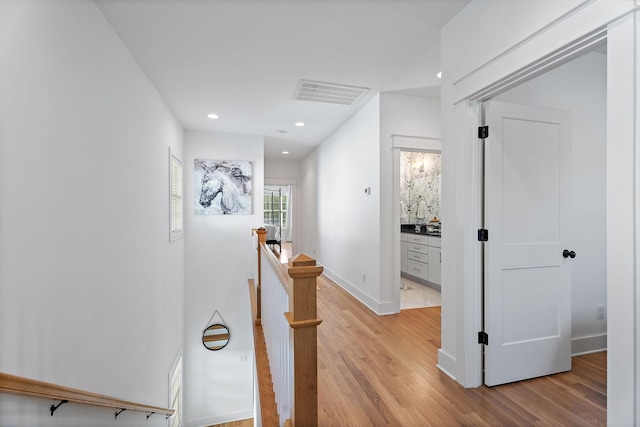 corridor featuring light wood-type flooring