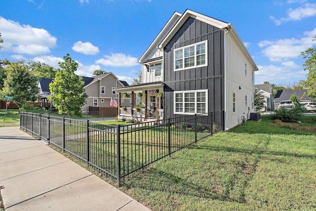 view of front facade featuring a front lawn, covered porch, and central air condition unit