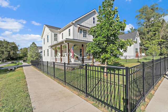 view of front facade featuring a porch and a front lawn