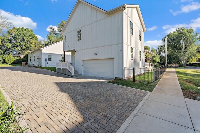 view of side of home featuring a garage