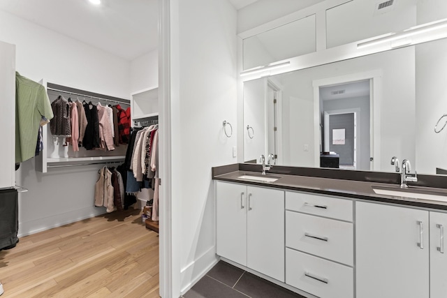 bathroom featuring vanity and wood-type flooring