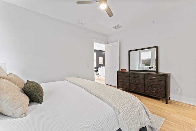 bedroom featuring light hardwood / wood-style floors and ceiling fan