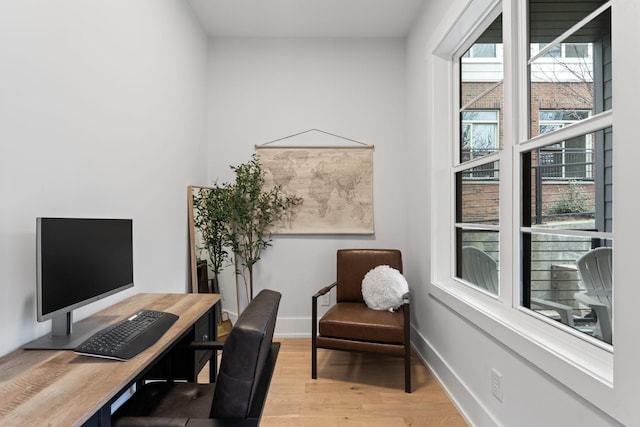 office space with light hardwood / wood-style flooring