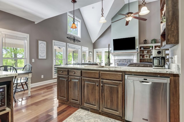 kitchen with dishwasher, ceiling fan, hardwood / wood-style floors, dark brown cabinets, and high vaulted ceiling