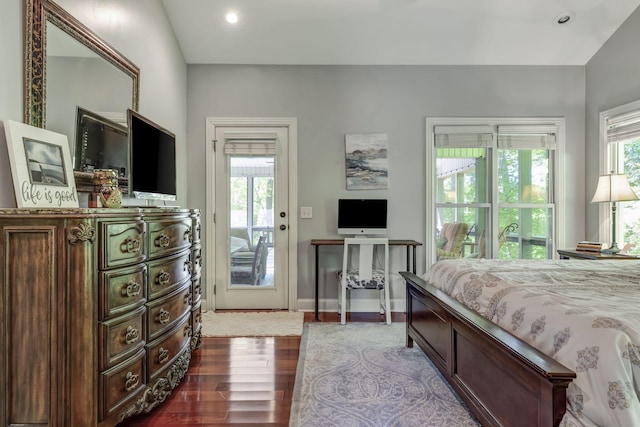 bedroom featuring dark hardwood / wood-style flooring and access to exterior