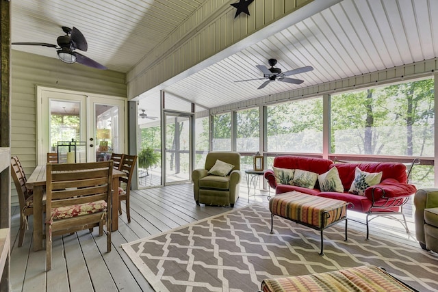 sunroom featuring lofted ceiling and ceiling fan