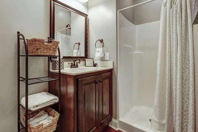 bathroom featuring vanity and walk in shower