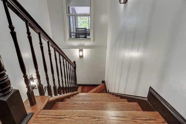 stairway with wood-type flooring