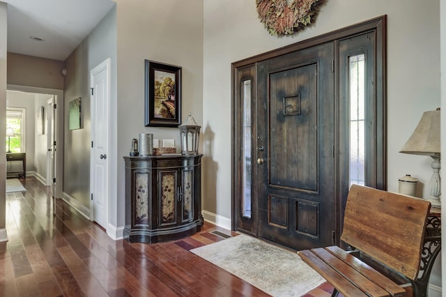 entrance foyer featuring dark hardwood / wood-style floors