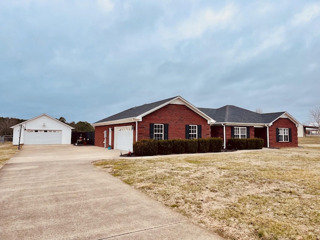 ranch-style home featuring a garage and a front lawn