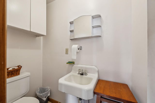 bathroom with toilet and sink