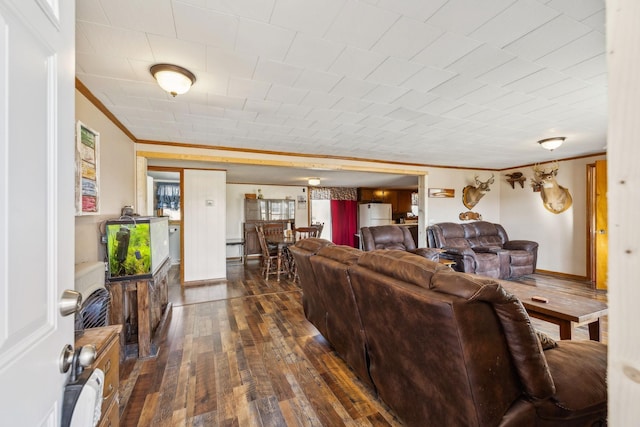 living room featuring ornamental molding and dark hardwood / wood-style floors