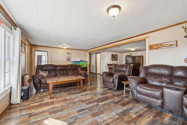 living room featuring dark hardwood / wood-style flooring and ornamental molding