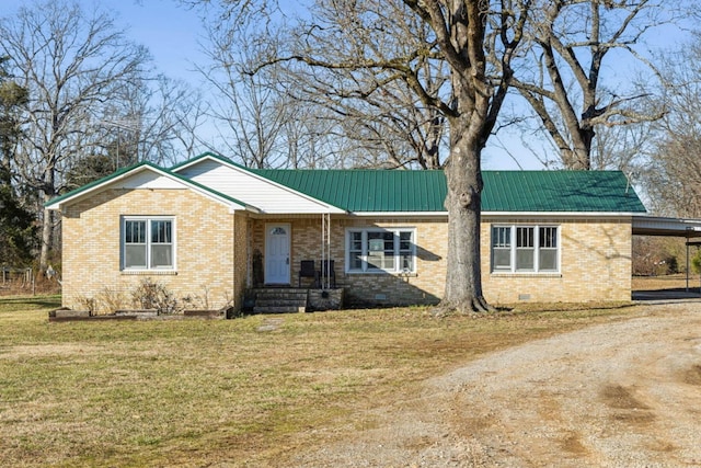 single story home featuring a carport and a front lawn