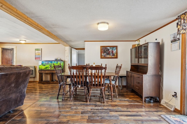 dining room featuring dark hardwood / wood-style flooring, crown molding, and a textured ceiling