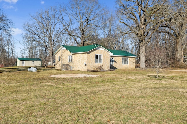 view of side of property with a yard