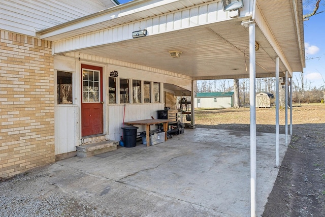 view of patio / terrace with a storage shed