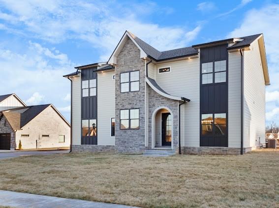 view of front of property featuring a garage and a front yard