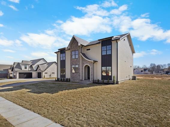 view of front of property featuring a residential view and a front yard