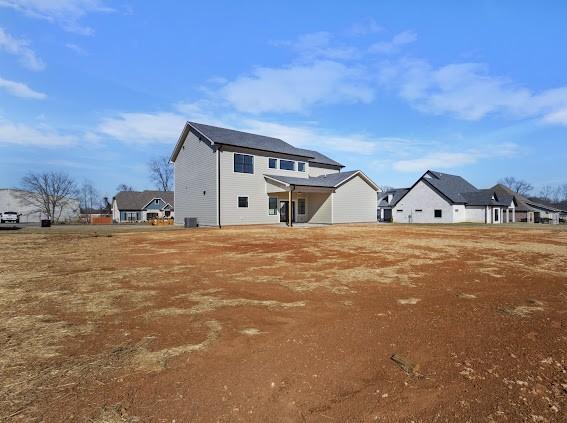 rear view of property featuring a residential view