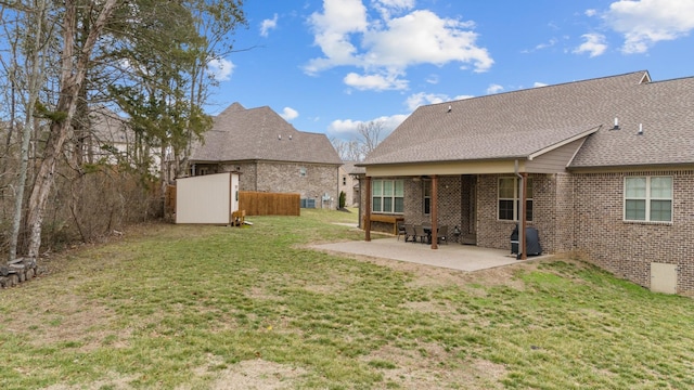 view of yard with a patio and a storage shed