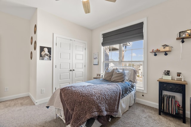 bedroom with light carpet, ceiling fan, and a closet