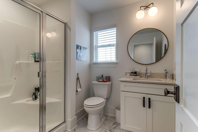 bathroom with a shower with door, vanity, and toilet