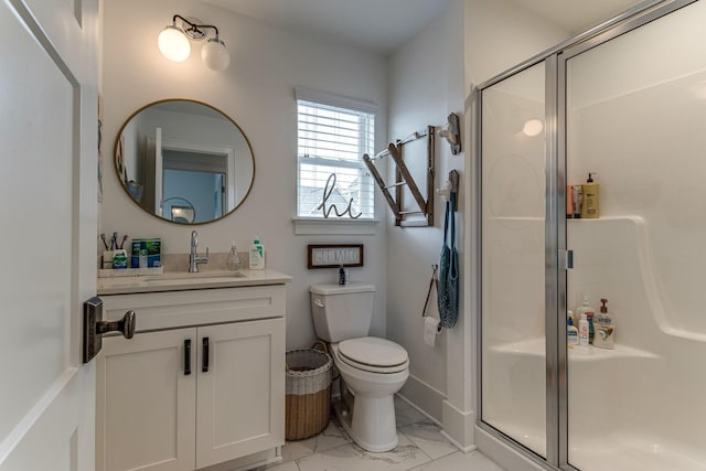 bathroom featuring vanity, toilet, and walk in shower