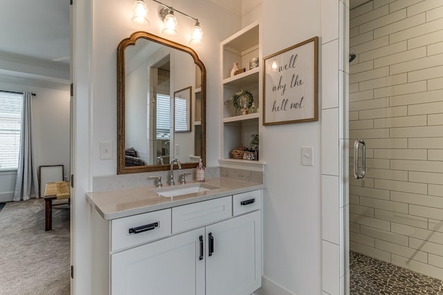 bathroom featuring an enclosed shower and vanity