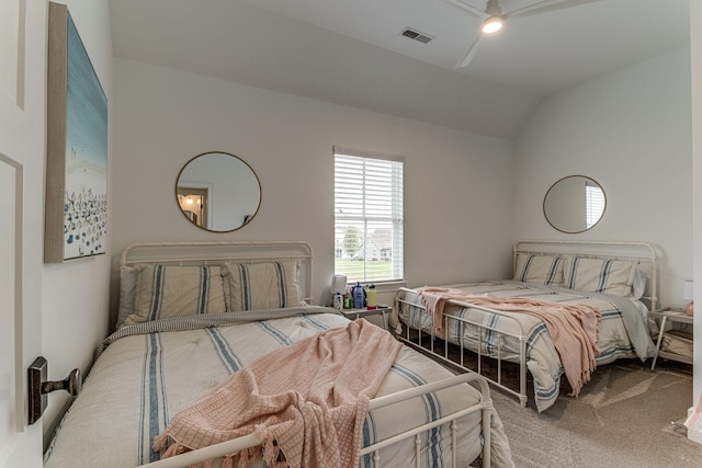 carpeted bedroom with vaulted ceiling and ceiling fan