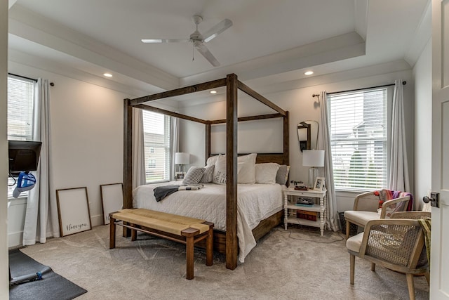 bedroom with crown molding, light carpet, and ceiling fan