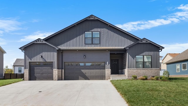 view of front of property featuring a garage and a front yard